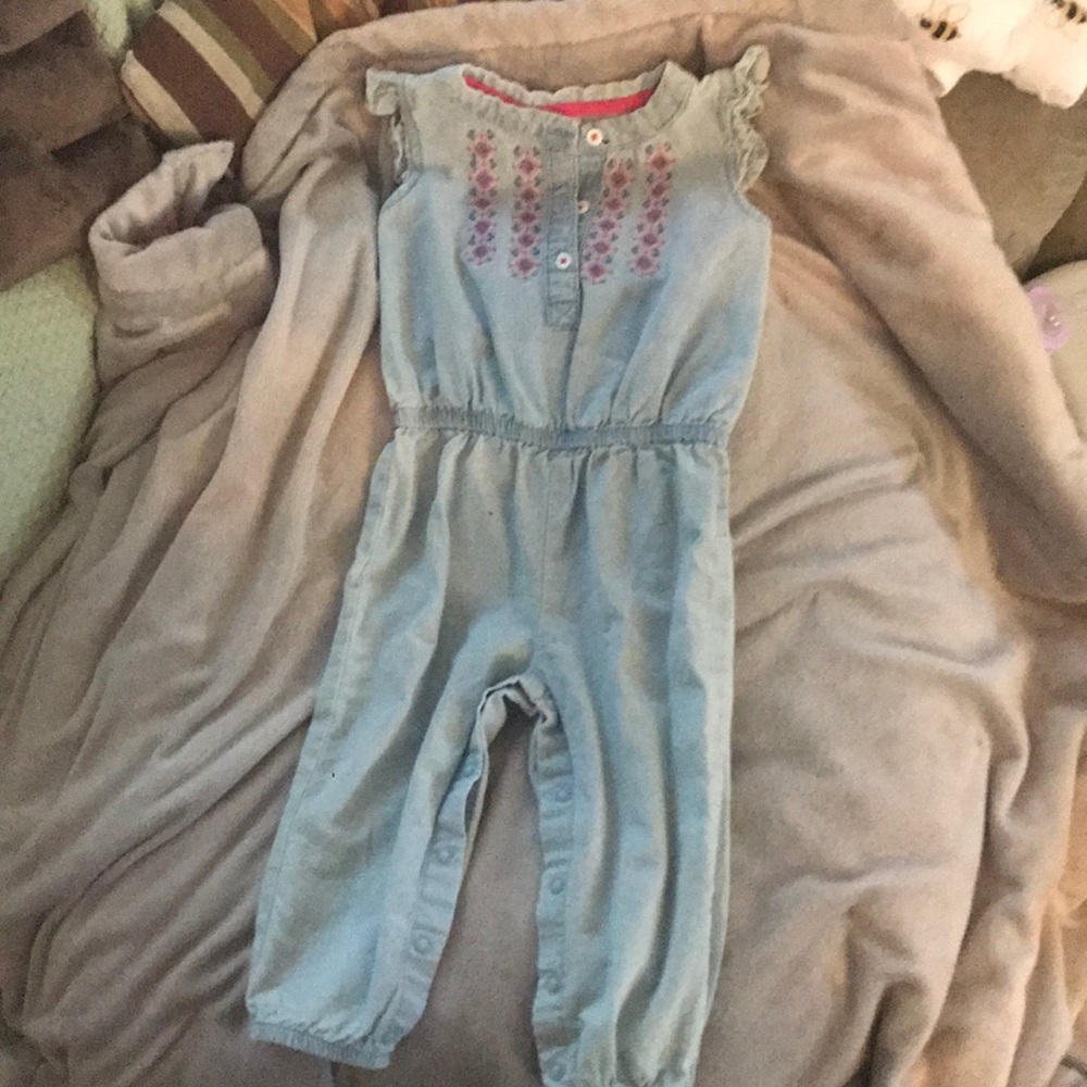 Baby jean romper, with pink detail.